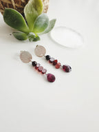 Aros silver “Enraíza” en piedras Granates. Incluye significado de la piedra y packing para regalo