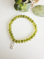 Pulsera de Plata 925 "Abundancia eterna" en piedra Peridoto. Incluye significado de su piedra y packing para regalo