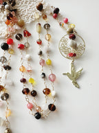 Collar Colibrí  “Esperanza del Alma”en piedras de tonos tierra.