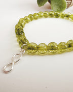 Pulsera de Plata 925 "Abundancia eterna" en piedra Peridoto. Incluye significado de su piedra y packing para regalo