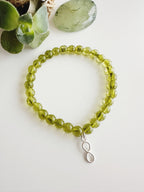 Pulsera de Plata 925 "Abundancia eterna" en piedra Peridoto. Incluye significado de su piedra y packing para regalo