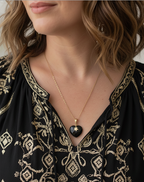 collar baño de oro en piedra de onix negro y estrella 